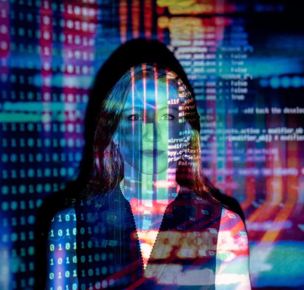 Code projected onto woman's face